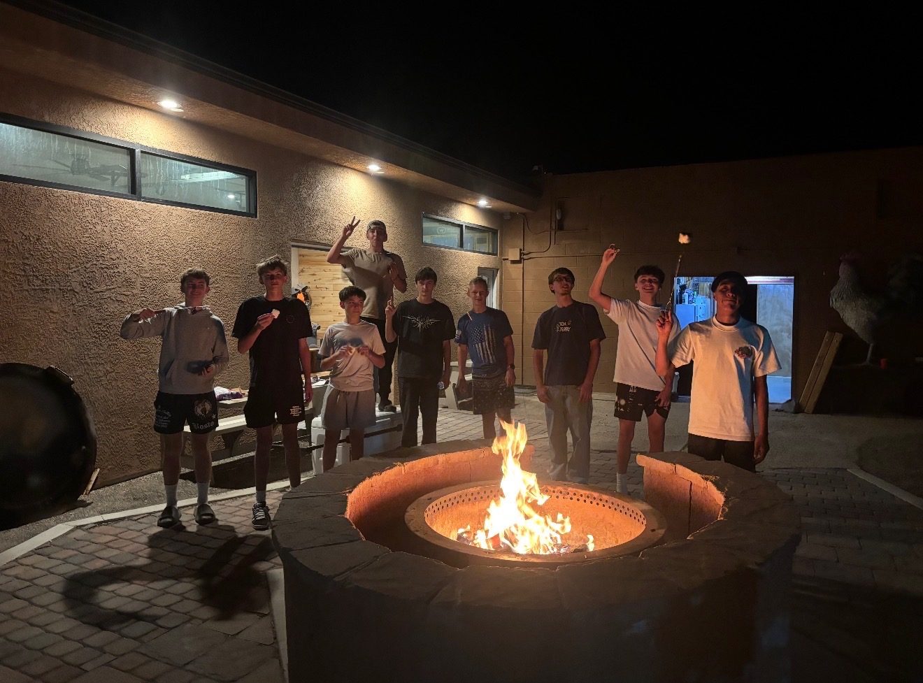 Group around the fire pit at night