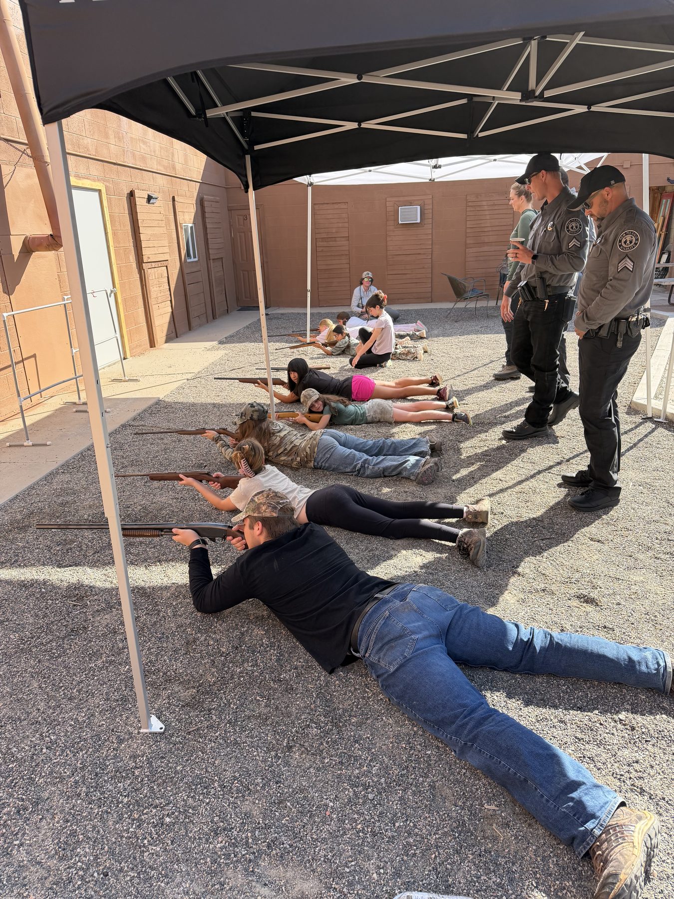 Youth shooting instruction on the range at The Cockhouse Lodge