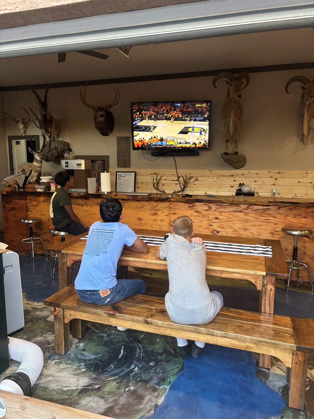 Common room with TV and trophy mounts